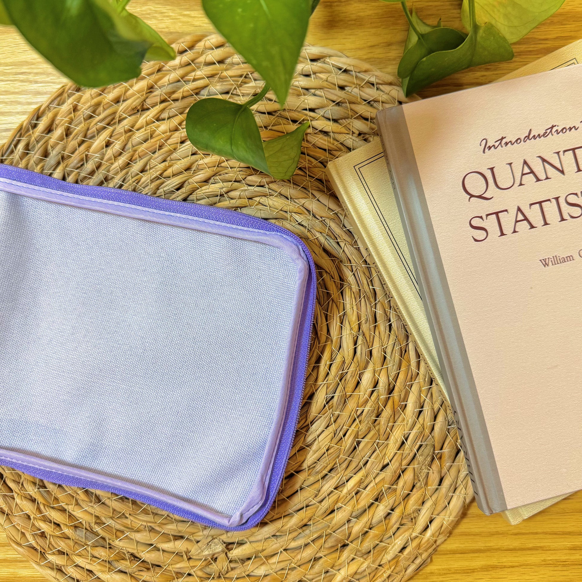 Backside of the Good Times Half-Stitch Kit pouch, plain lavender fabric with purple border.