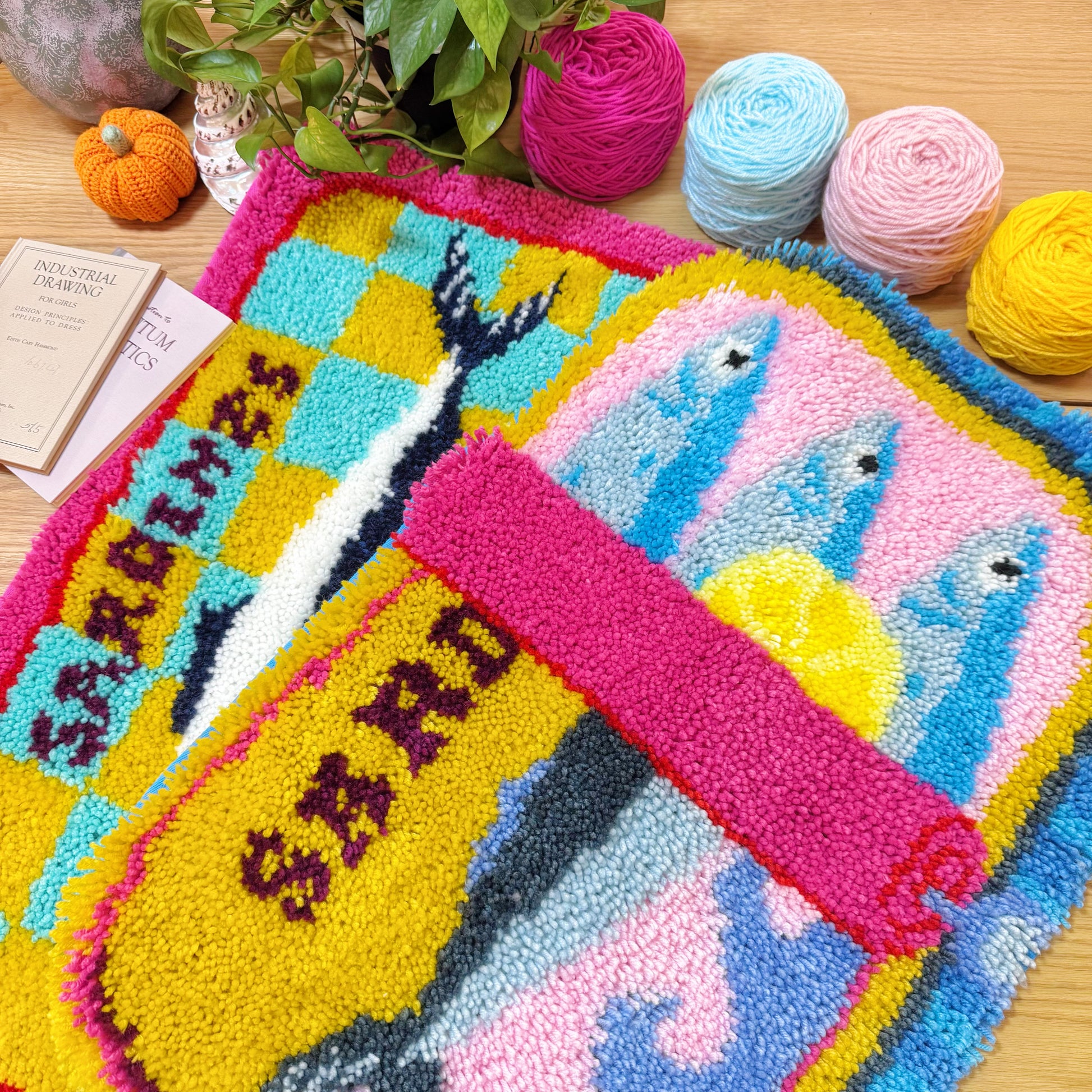 Two completed Sardine Delight latch hook rugs with sardine can pattern design